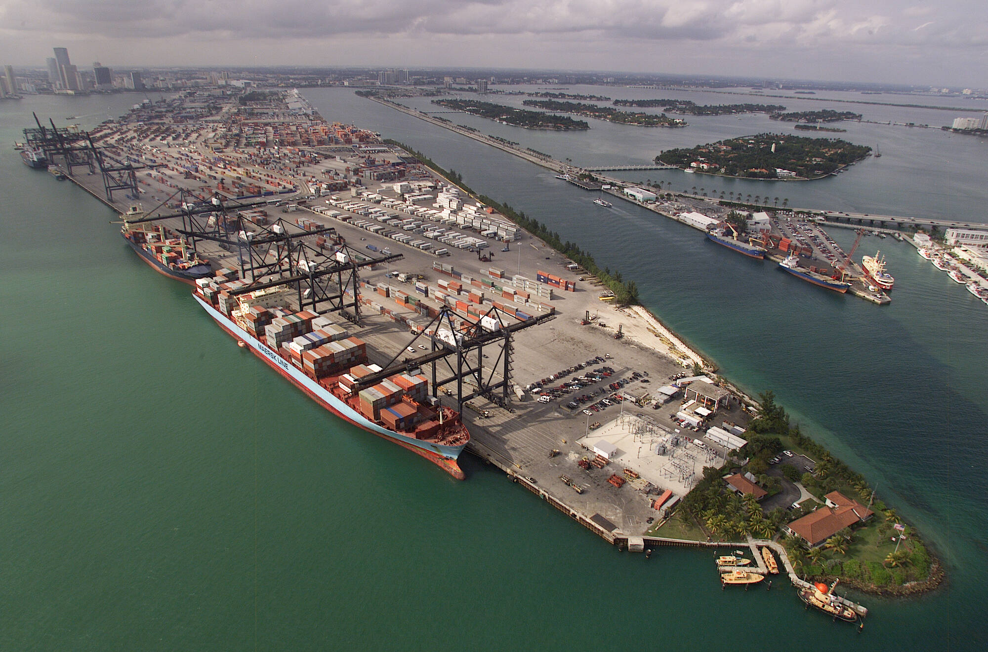 Aerial view of a container terminal with a loaded ship alongside the quay
